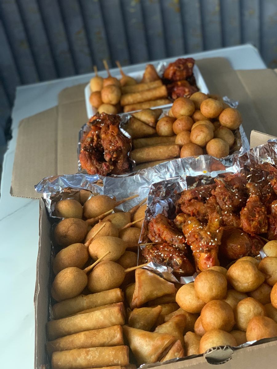 Small chops tray: puff-puff, samosa and spring rolls by TashBliss Events